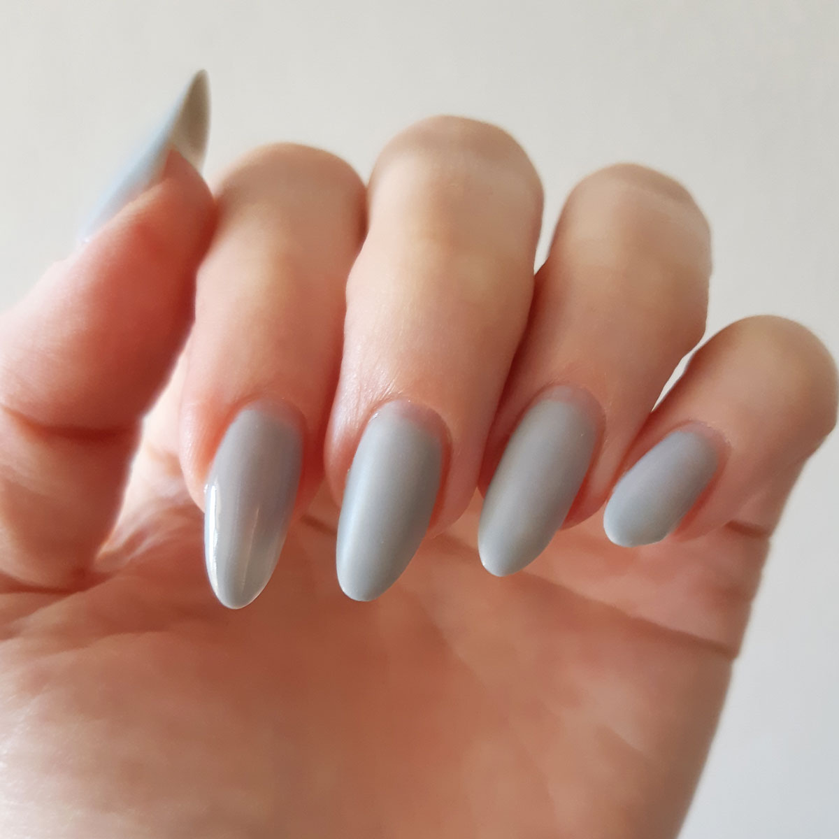 zoom in almond nails light grey gel colour with matte top coat on 2 middle nails and glossy top coat on the others for a very chic effect on your nails Shop the shade Winter Chic Gel Polish by Nail Art Bay Australia Gel polish Colours for nail art and nails at home