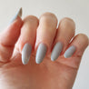 zoom in almond nails light grey gel colour with matte top coat on 2 middle nails and glossy top coat on the others for a very chic effect on your nails Shop the shade Winter Chic Gel Polish by Nail Art Bay Australia Gel polish Colours for nail art and nails at home